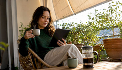 Woman browsing specialty coffee online at home