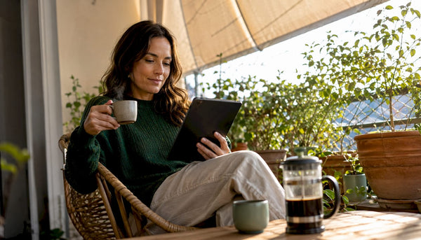 Woman browsing specialty coffee online at home