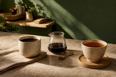 Coffee and tea cups side by side