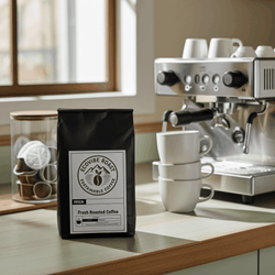 Bali Coffee Pods medium-dark roast with dark chocolate and molasses notes by Kintamani growers next to espresso machine and cups