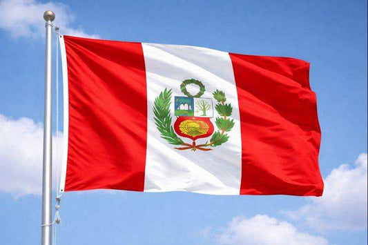 Peruvian flag waving in the sky representing Peru Decaf Coffee origin