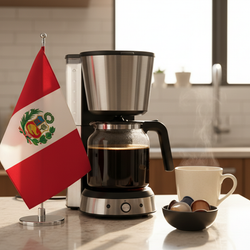 Peru coffee pods beside coffee maker and steaming cup on kitchen counter with Peruvian flag