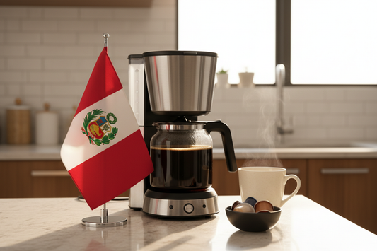 Peru coffee pods beside coffee maker and steaming cup on kitchen counter with Peruvian flag