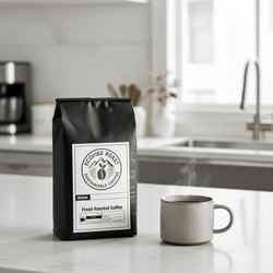 African Espresso Blend medium-dark roast coffee bag with steaming cup on kitchen counter