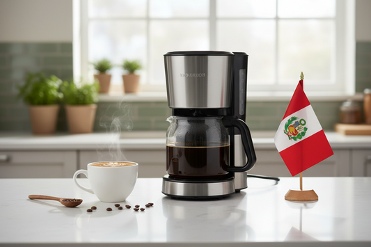lifestyle picture with a coffee maker on a kitchen counter with a half-filled coffee pot with the Peru flag the right side and a cup of brewed coffee on the other side